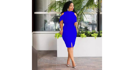 Woman wearing an elegant black bodycon dress with beaded details and tea-length design.