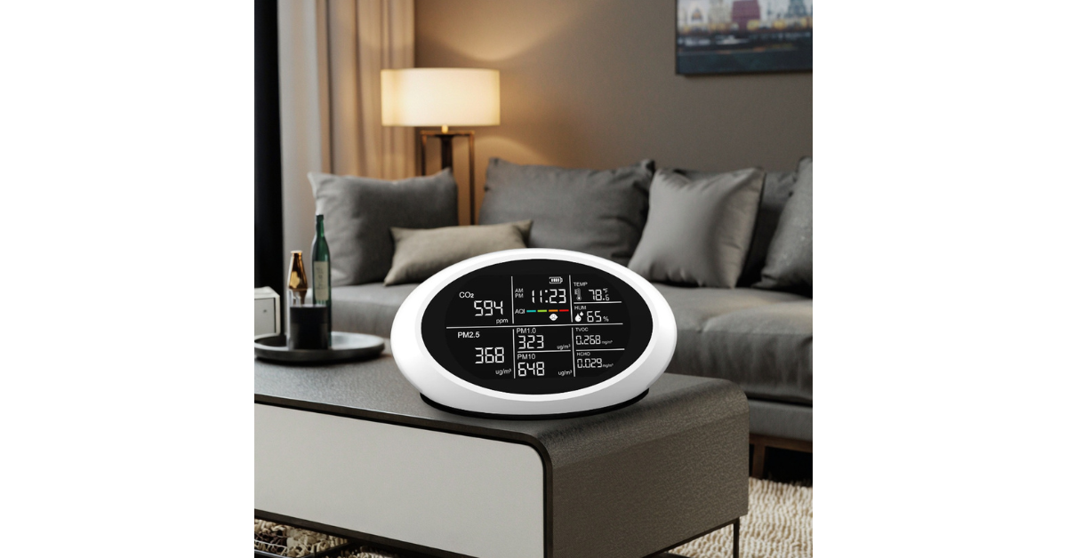 DM605E on office desk near laptop