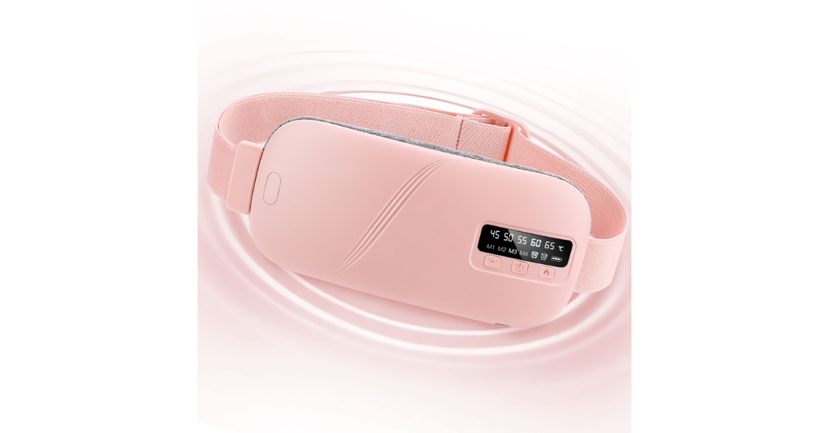 Woman using abdominal massager for cramps