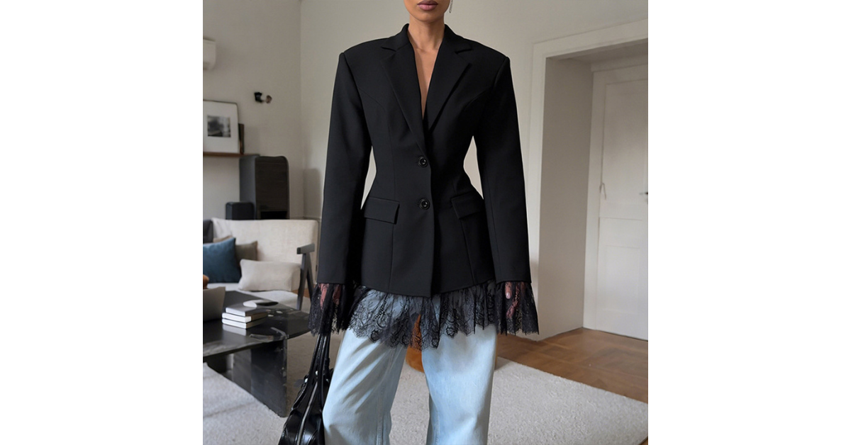 Close-up of blazer button and lace embroidery