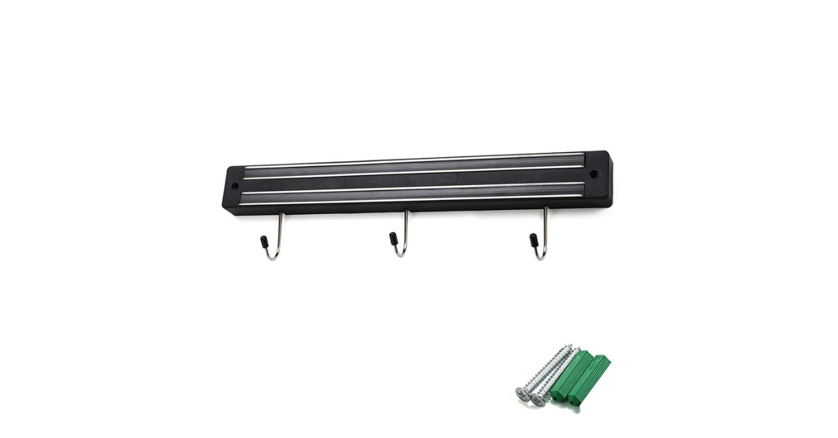 Modern kitchen with wall-mounted magnetic knife strip holding knives