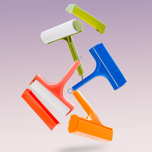 Eco-friendly manual lint roller for removing pet hair, lint, and dust from clothing and fabric surfaces.