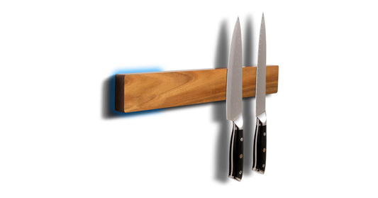 Magnetic knife holder with chef knives in a modern kitchen