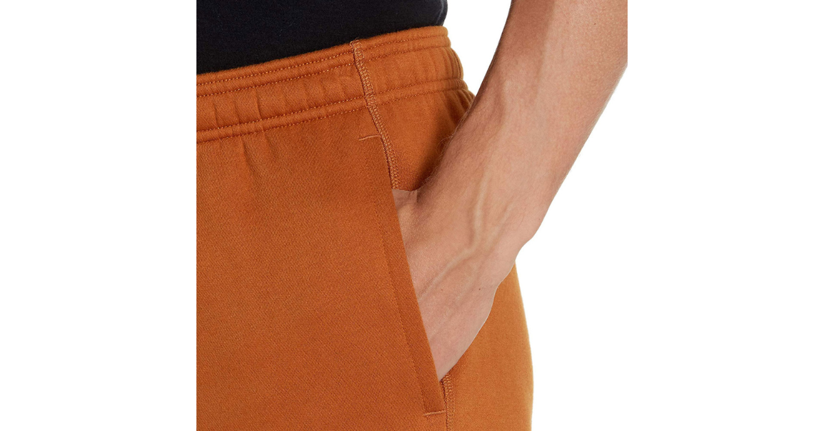Male model running outdoors wearing joggers