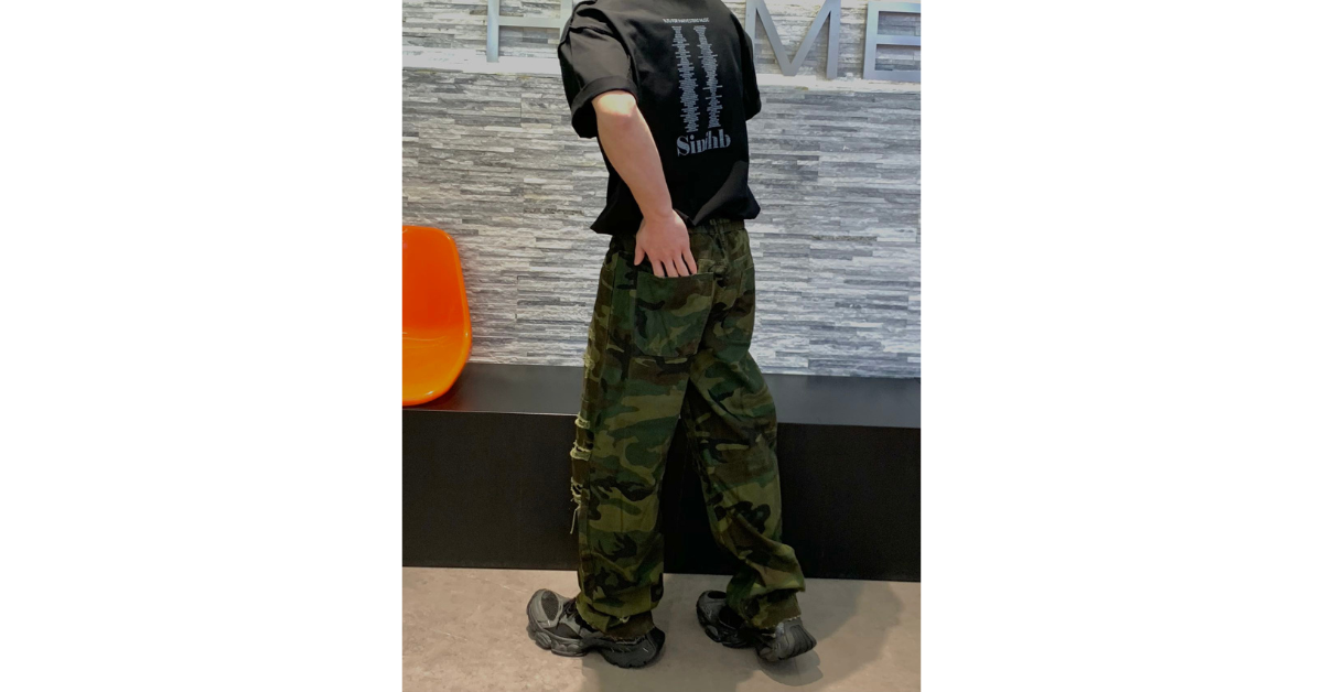 Side view of distressed ripped cargo pants