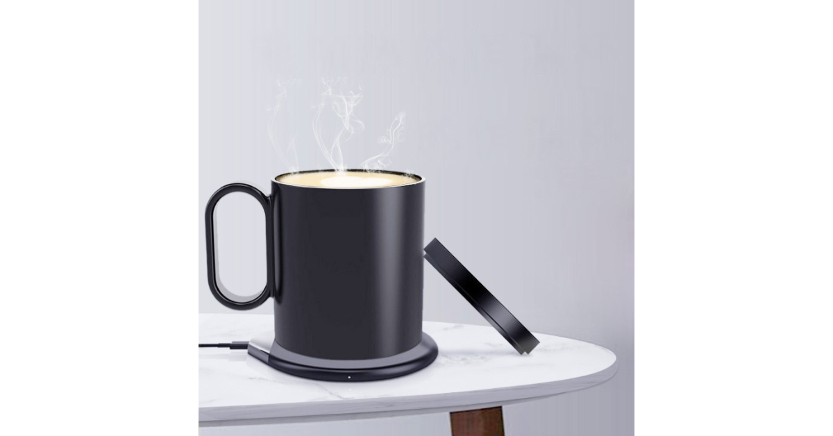Smart mug warmer keeping coffee hot on office desk