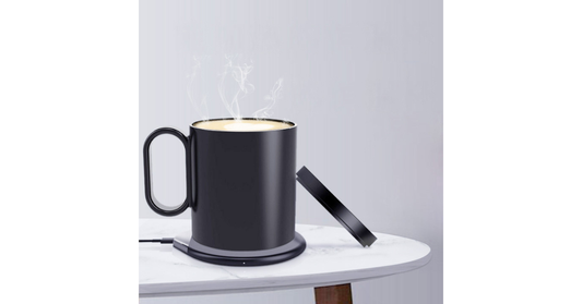 Smart mug warmer keeping coffee hot on office desk