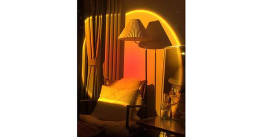 Smart RGB sunset lamp projecting colorful ambient lighting in a modern bedroom