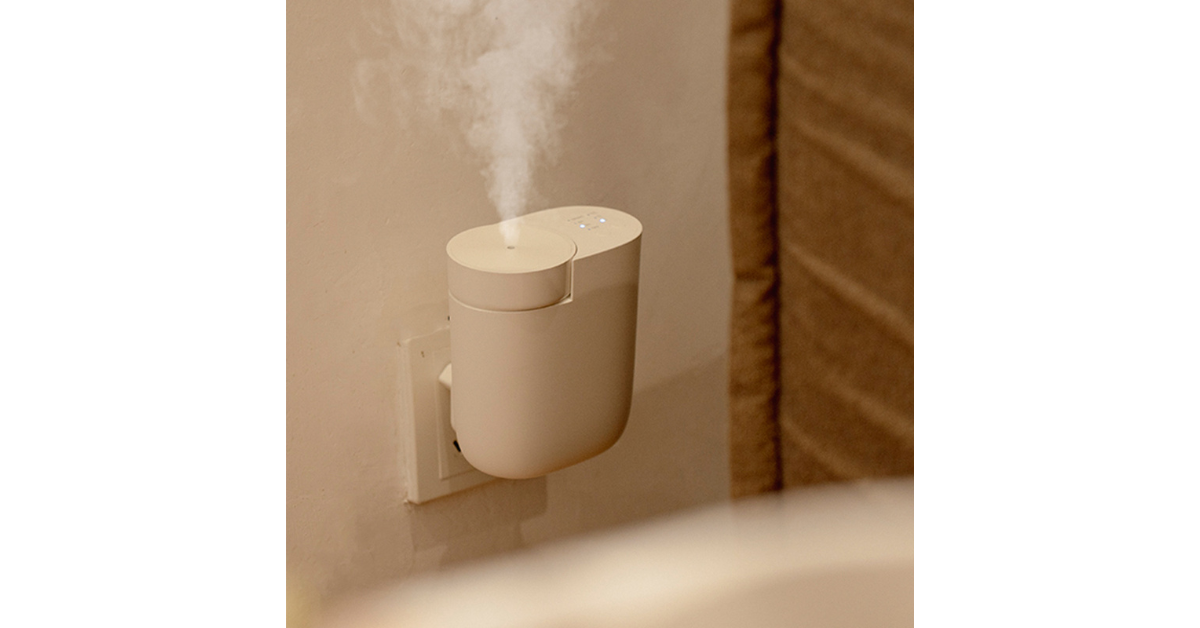 Automatic refill essential oil diffuser in modern home