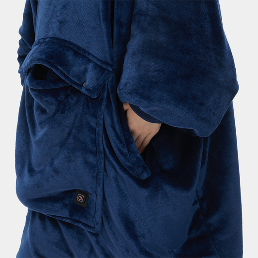 Adult wearing oversized wearable blanket hoodie in living room