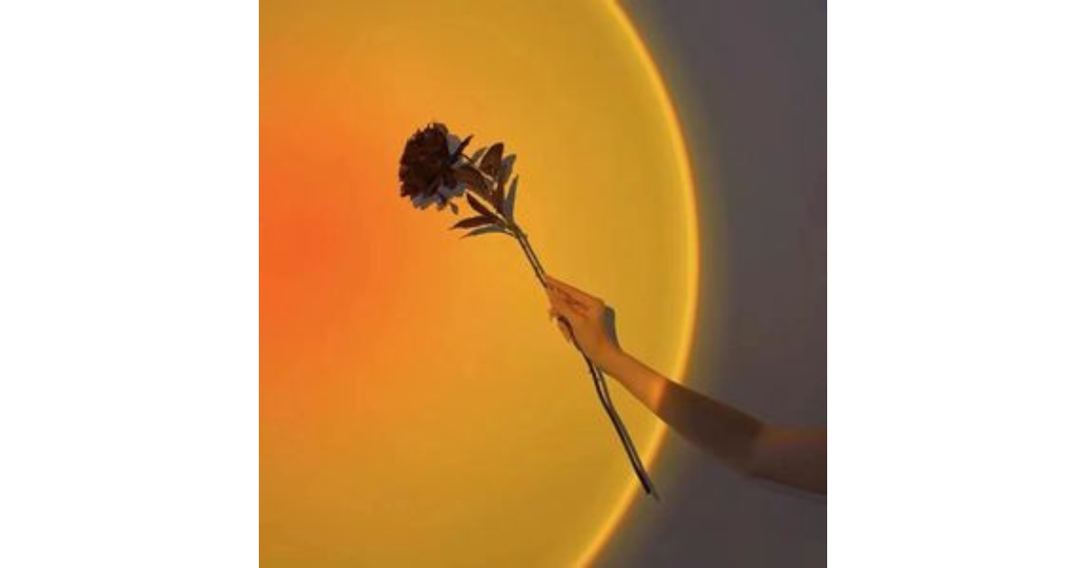 TikTok sunset lamp creating cozy bedroom mood lighting