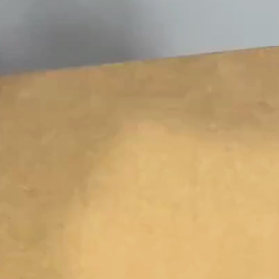Cozy winter home video showing a woman wearing tan UGG slippers near a fireplace.